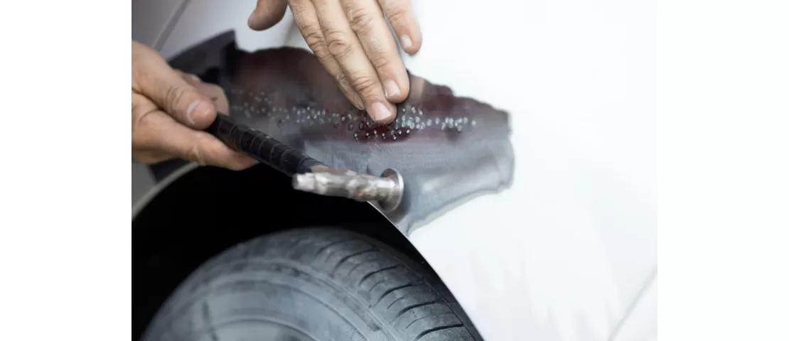 Panel beating a dented wing